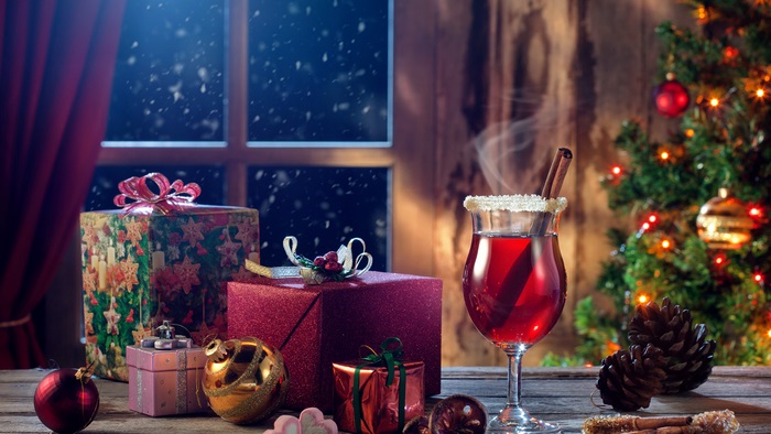 Christmas scene with gifts and mulled wine