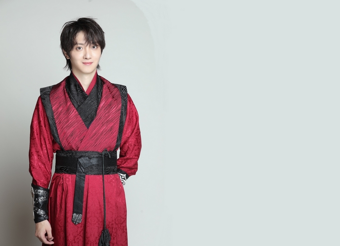 Paul Yu in traditional red and black attire