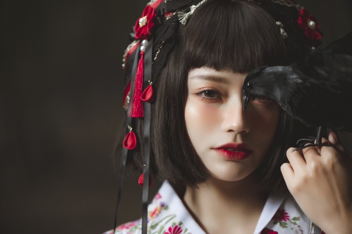 Asian Woman with Crow and Floral Attire