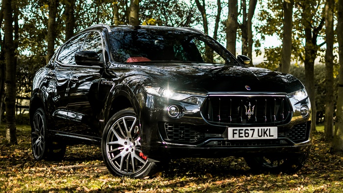 Black 2017 Maserati Levante GranSport SUV in forest