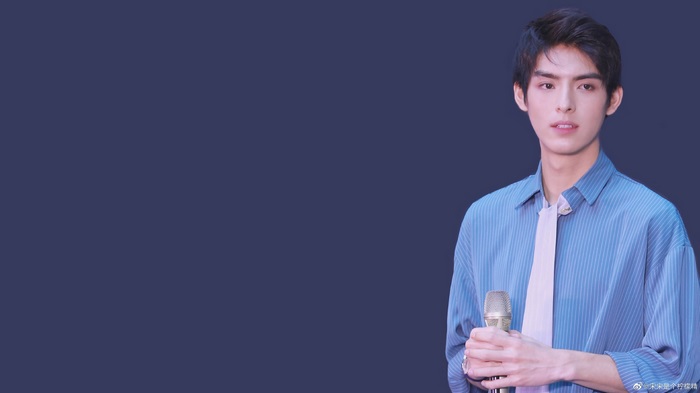 Wang Hao Xuan holding a microphone