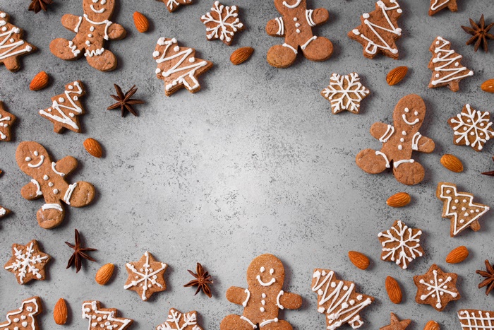 Gingerbread Cookies and Almonds on Gray Surface