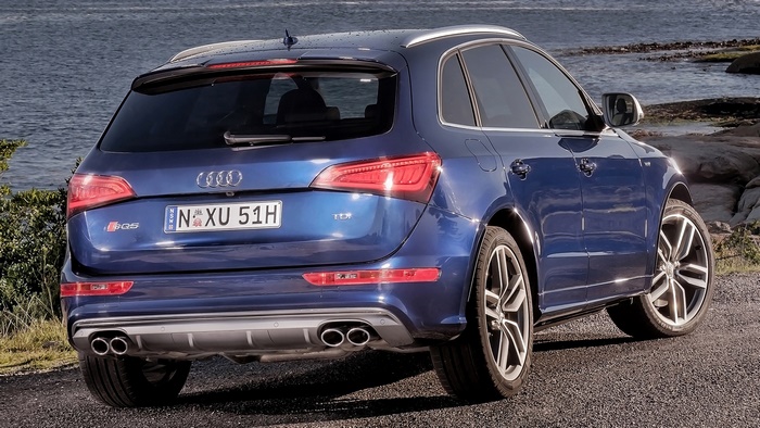 Blue Audi SQ5 TDI parked by the water