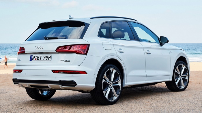White Audi Q5 45 TFSI parked on a beach