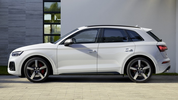 White Audi SQ5 Crossover SUV parked outside modern building