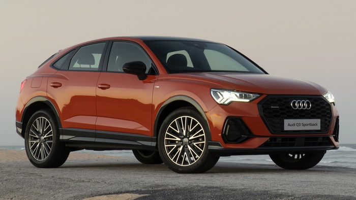 Orange Audi Q3 Sportback S Line parked on a beach