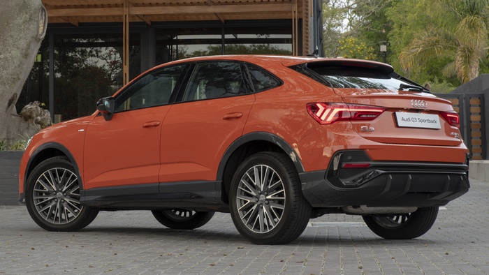 Orange Audi Q3 Sportback S Line parked on a paved surface