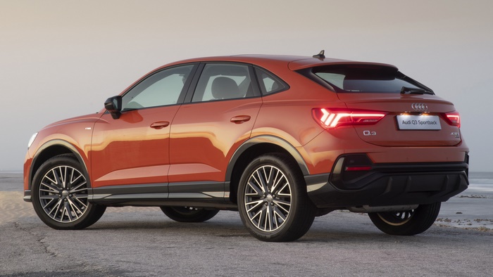 Orange Audi Q3 Sportback S Line parked on a beach