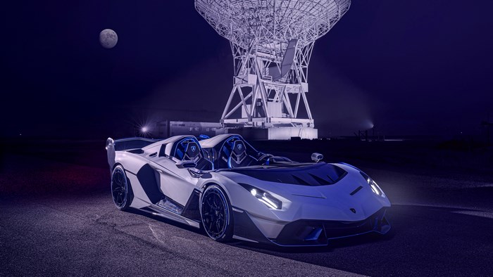 Lamborghini SC20 supercar at night near a radio telescope