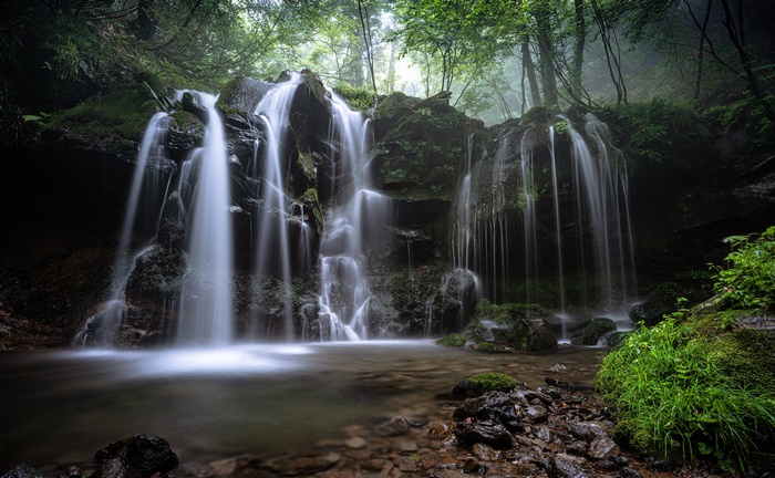 Waterfall in a Forest with Stream and Rocks