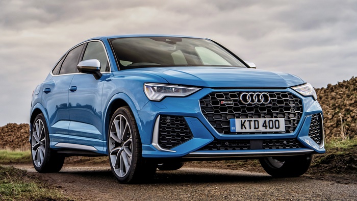Blue Audi RS Q3 Sportback on a dirt road