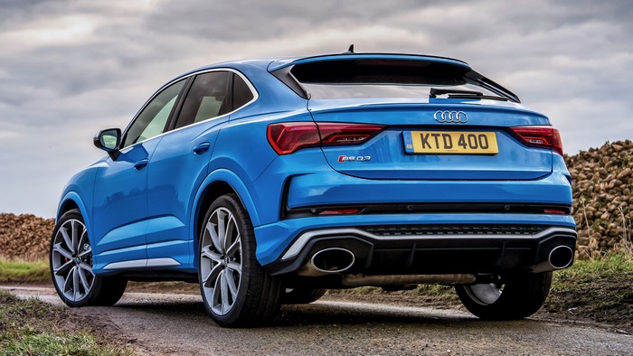 Blue Audi RS Q3 Sportback on a dirt road