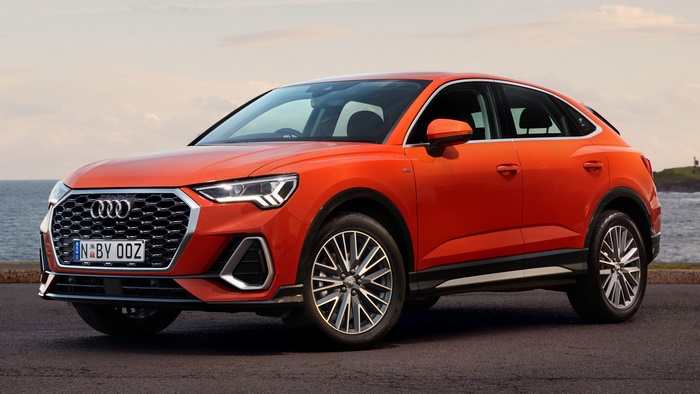 Orange Audi Q3 Sportback S Line parked by the sea