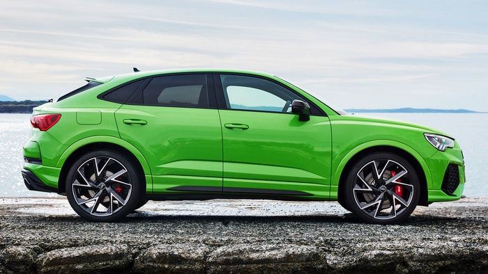 Green Audi RS Q3 Sportback parked by the water