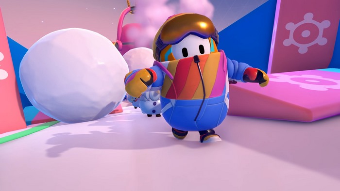 Fall Guys character in winter outfit with giant snowball