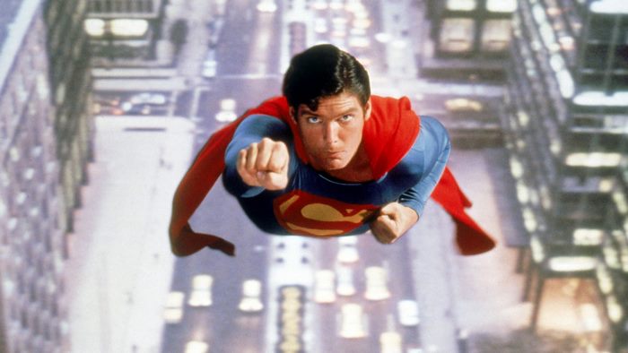 Superman flying over a city