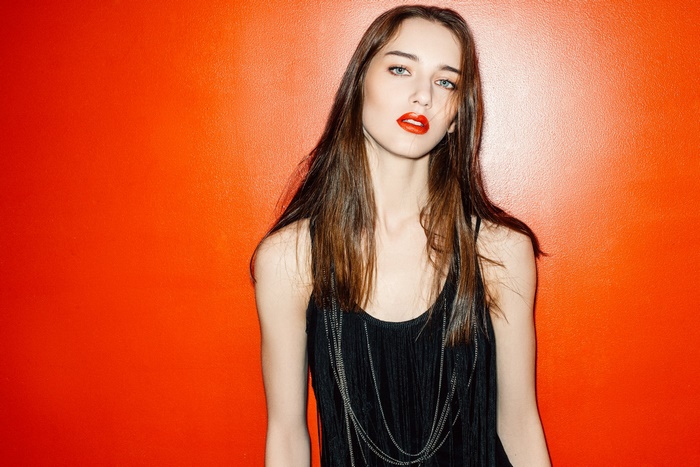 Brunette Woman with Blue Eyes and Red Lipstick