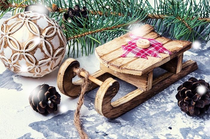 Christmas sled with bauble and pine cones