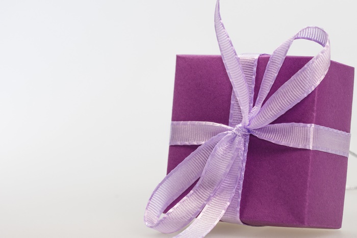 Purple gift box with ribbon