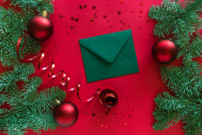 Christmas decorations with green envelope and red ribbon