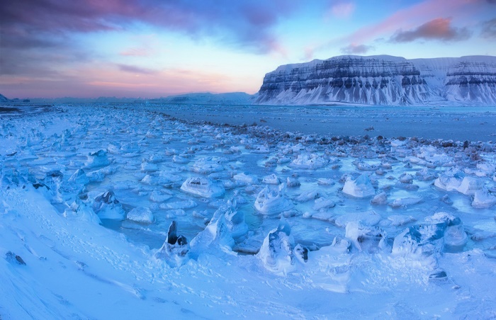 Ice floes and mountains at sunset
