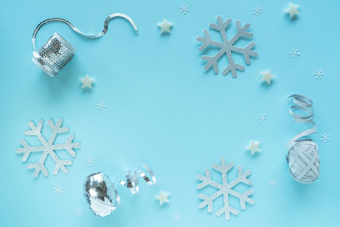 Silver Snowflakes and Stars on Blue Background