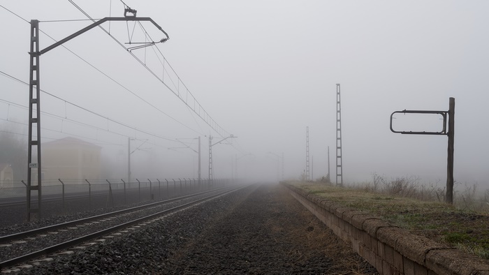 Railroad tracks in fog