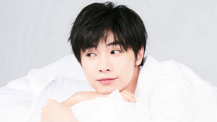 Song Ji Yang lying on white sheets
