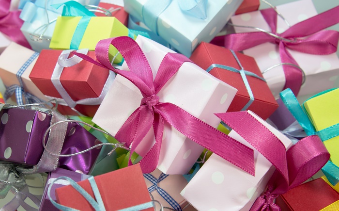 Pile of colorful gift boxes with ribbons