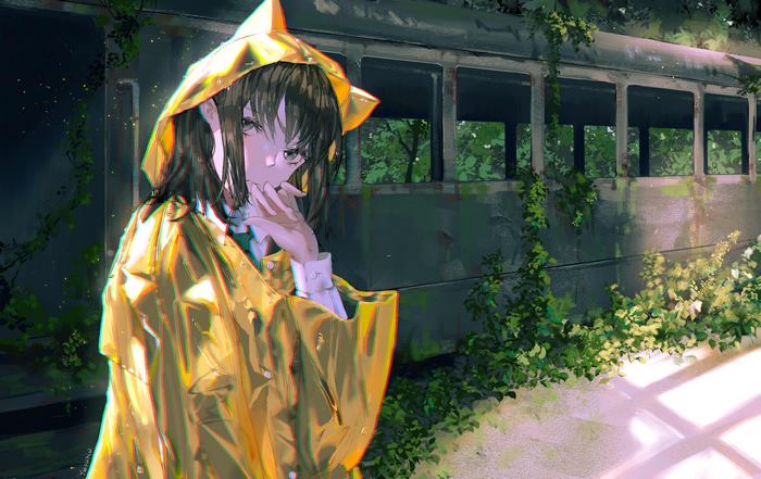 Girl in yellow raincoat by abandoned train