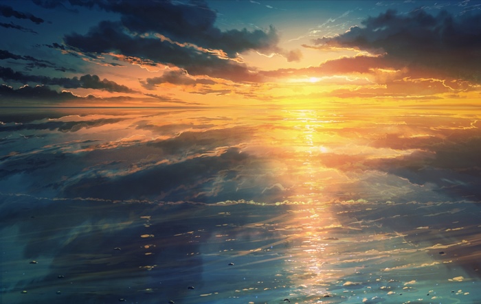 Sunset over the ocean with clouds
