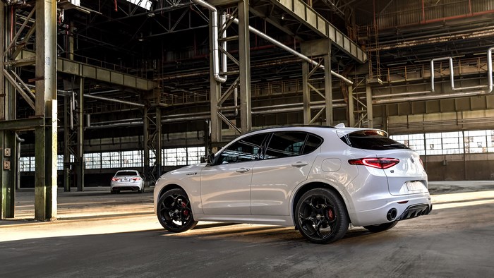 White Alfa Romeo Stelvio Veloce Ti SUV in industrial building