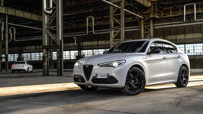White Alfa Romeo Stelvio Veloce Ti SUV in industrial building