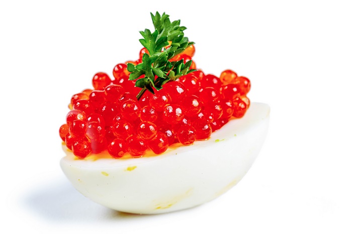 Deviled Egg with Red Caviar and Parsley
