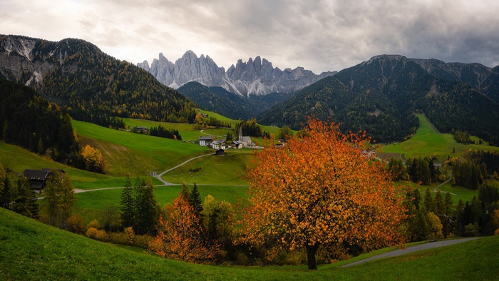 Autumn Village in the Alps with Jagged Mountains