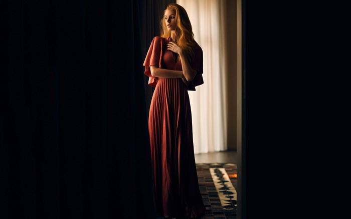 Elegant Blonde Model in Flowing Dress