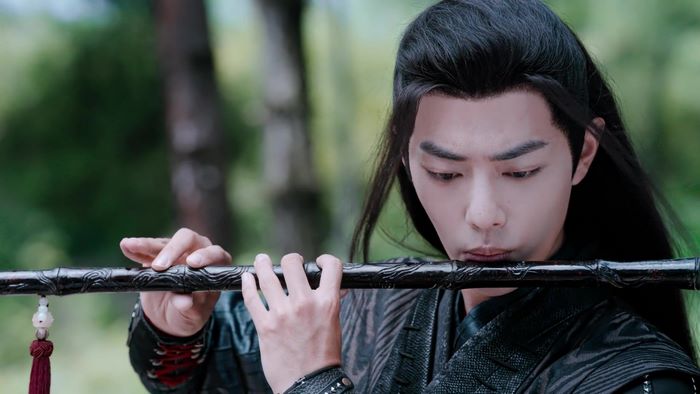 Wei Wuxian from The Untamed playing a flute