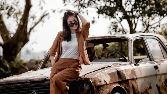Stylish Asian Woman Posing by Rusty Car