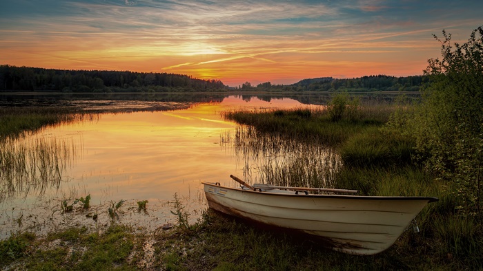 Boat on a lake at sunset