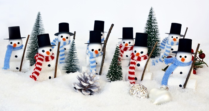 Christmas snowmen figurines with trees and decorations