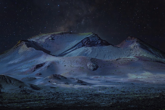 Mountain landscape under starry night sky