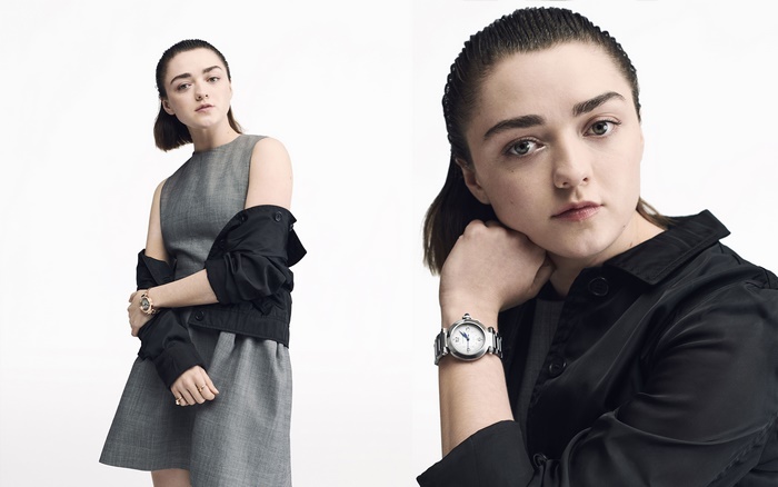 Maisie Williams wearing a grey dress and black jacket