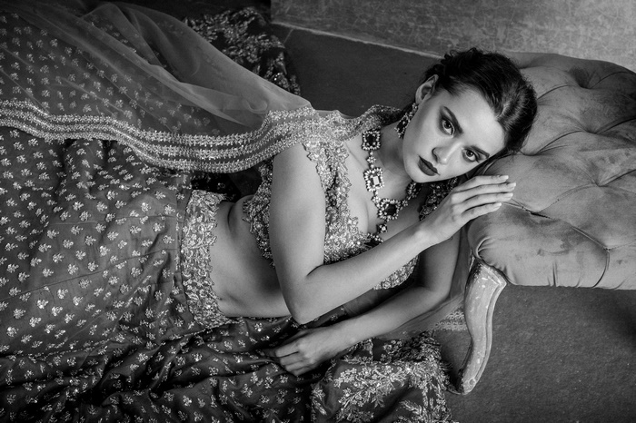 Woman in traditional Indian attire with jewelry