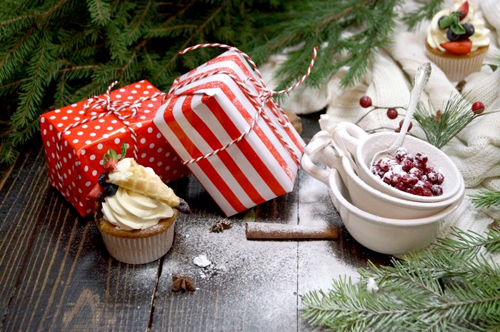 Christmas gifts and cupcake with berries