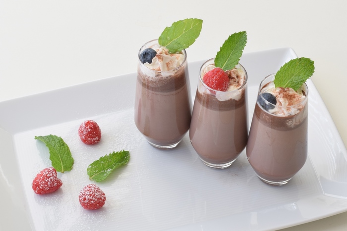 Chocolate dessert with berries and mint