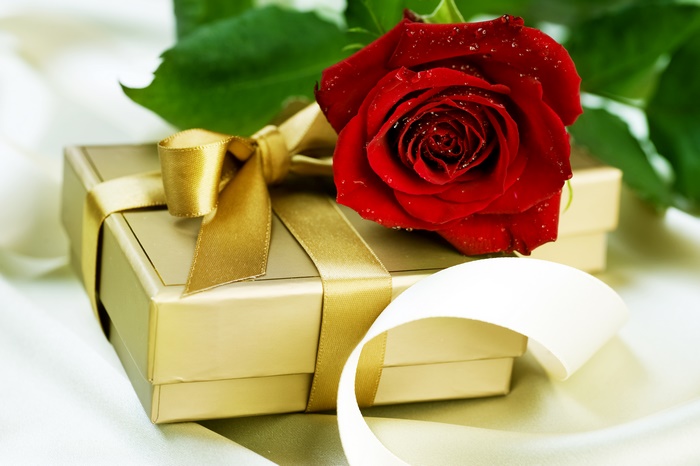 Red Rose on a Golden Gift Box