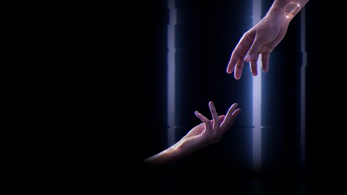 Two hands reaching towards each other with glowing symbols