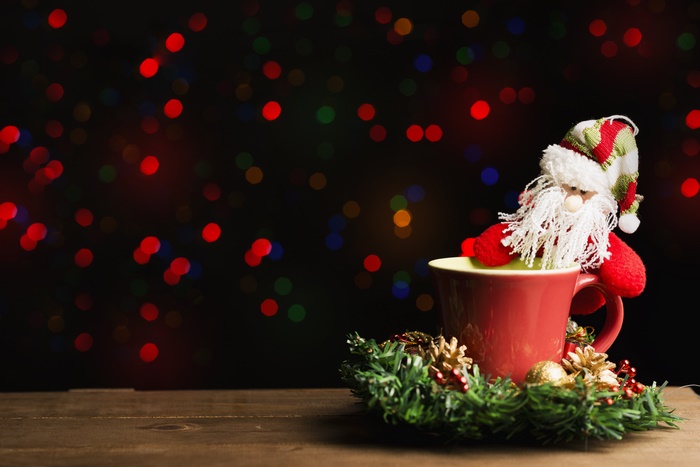 Santa Claus in a mug with Christmas lights