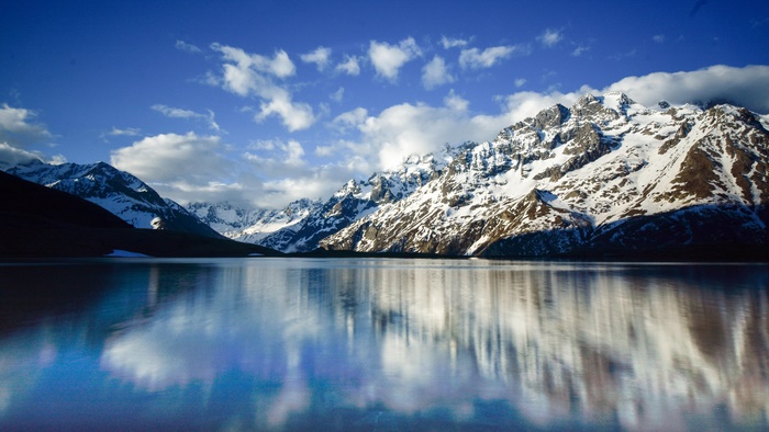 Snowy Mountains Reflected in a Lake