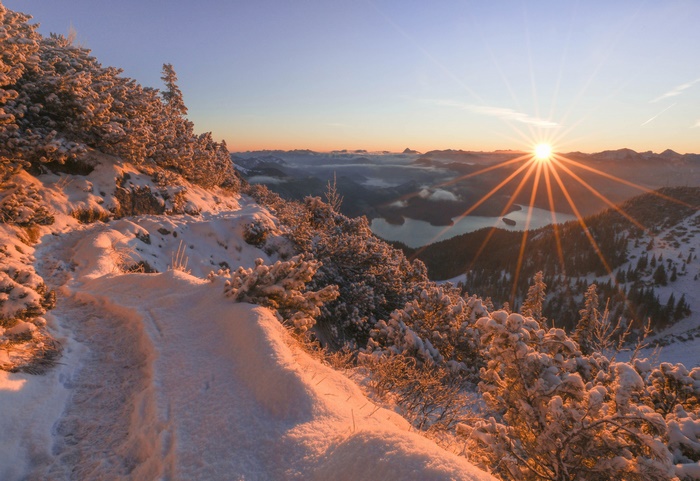 Sunset over snowy Bavarian Alps with a lake